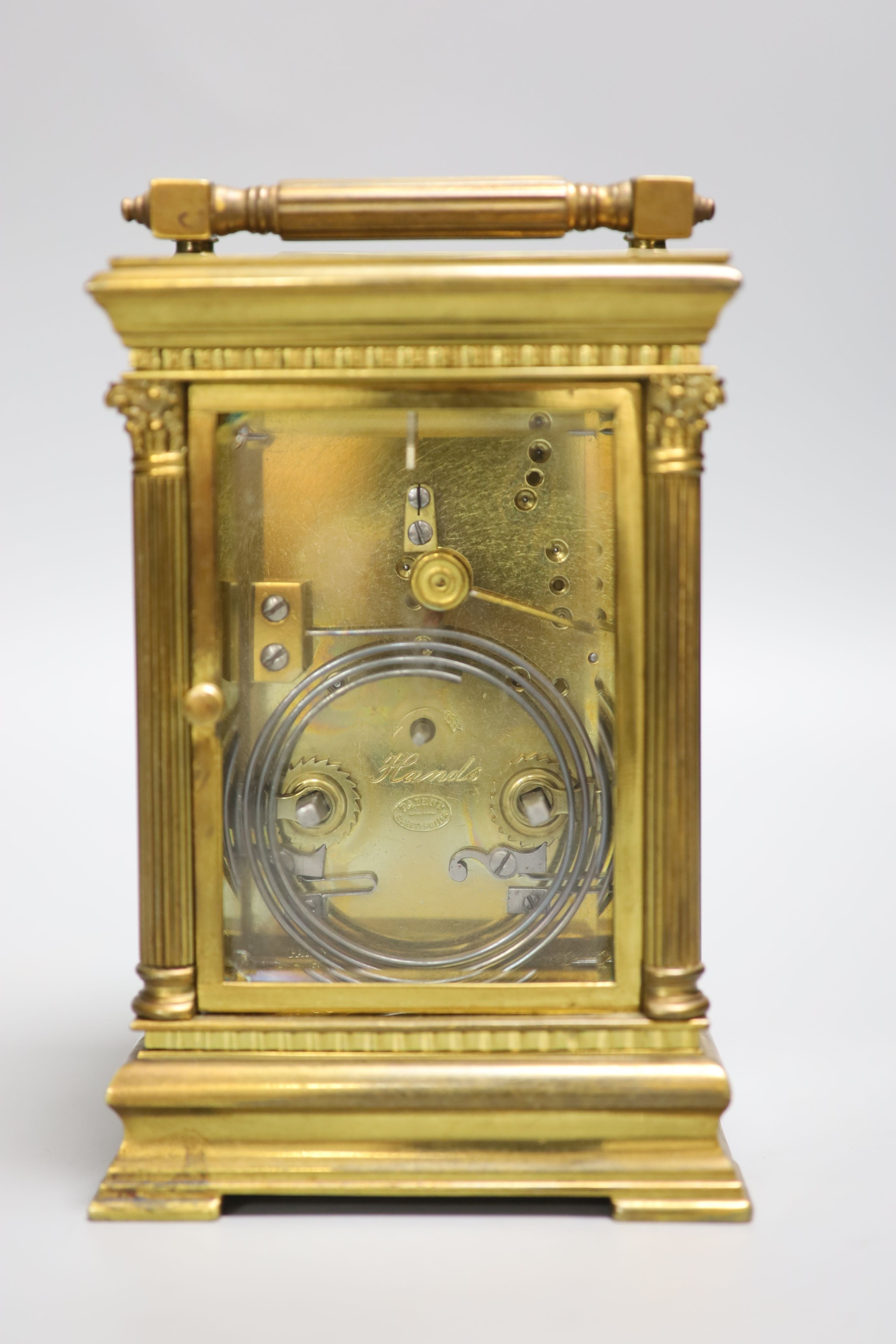 An Edwardian Corinthian brass repeating carriage clock, 20cm high to handle